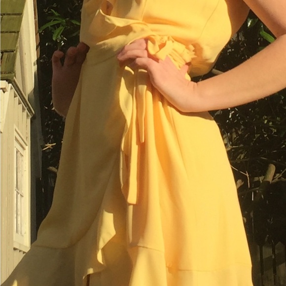 Aritzia wrap dress with flattering ruffle edging. Size 6 in butter yellow - Picture 3 of 6